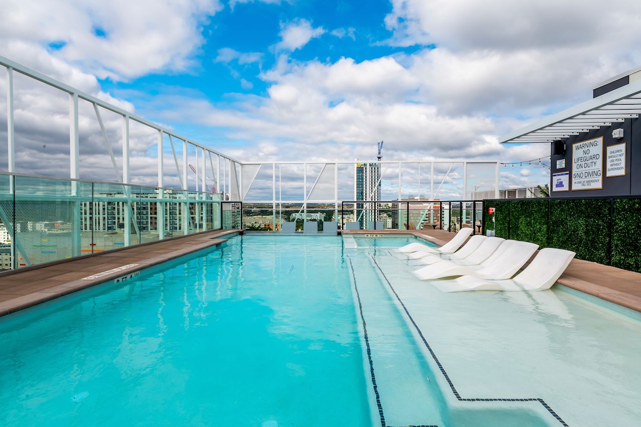 rooftop pool with water loungers villas on rio austin