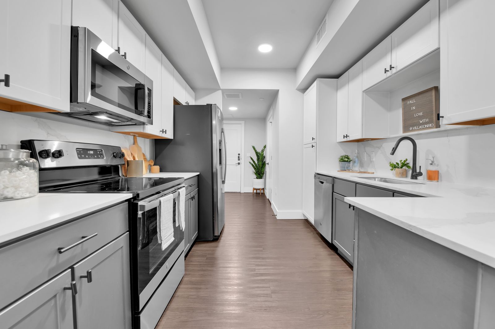 modern grey kitchen with stainless steel appliances villas on rio apartments